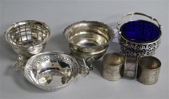 A pierced silver sugar basket, with blue glass liner and six other items,